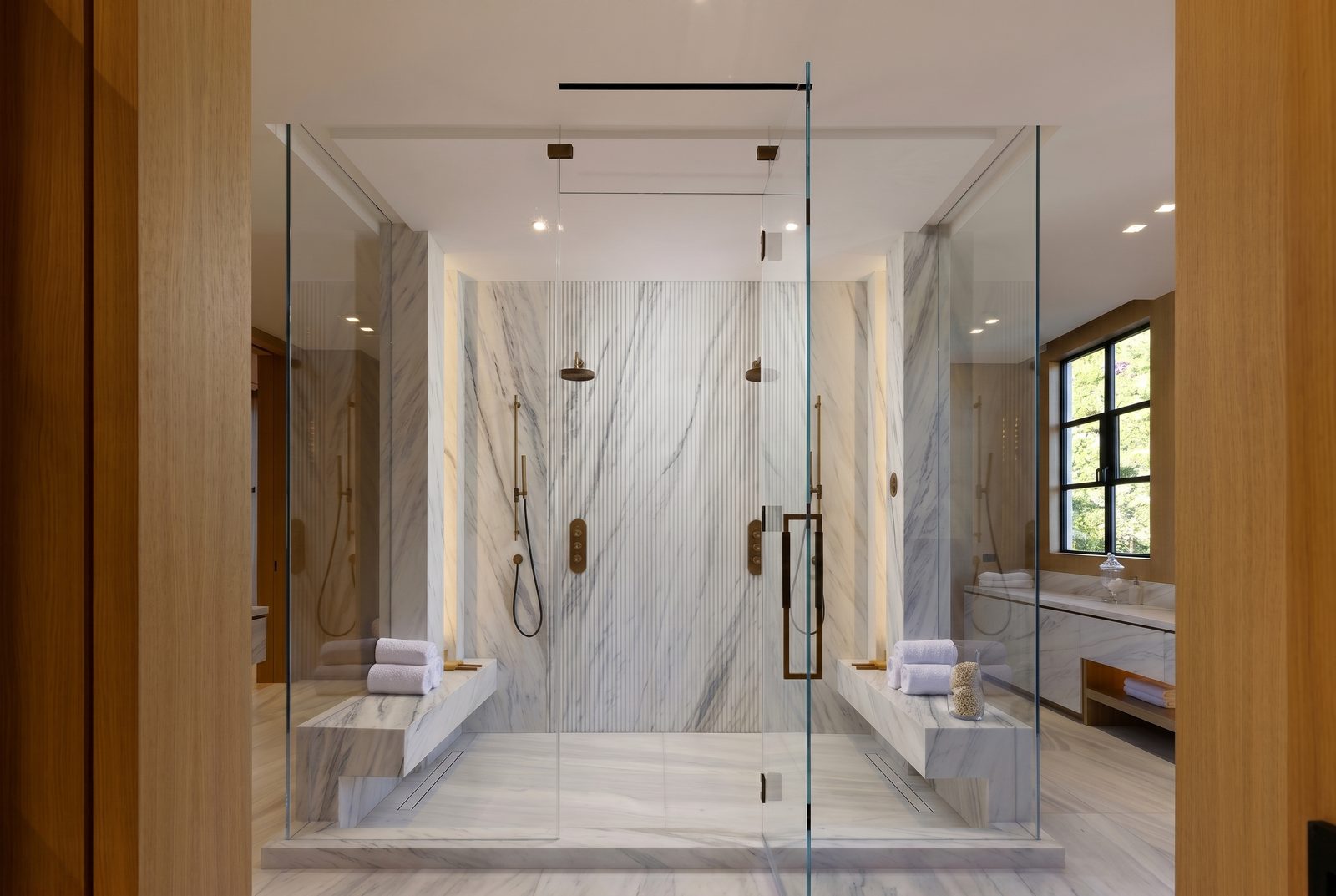 Oliveto Vale, Bel-Air residence by Beverly Hills One — primary bath in book-matched stone